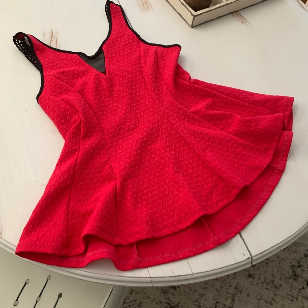 Pink fitted top with cute black lace accents. Pull on style, stretchy fabric.